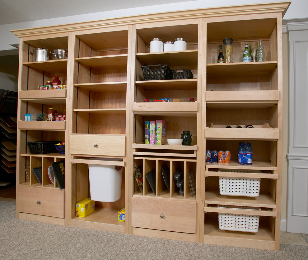 Inspiration for a large classic kitchen pantry in Chicago with flat-panel cabinets, light wood cabinets, carpet and brown floors.