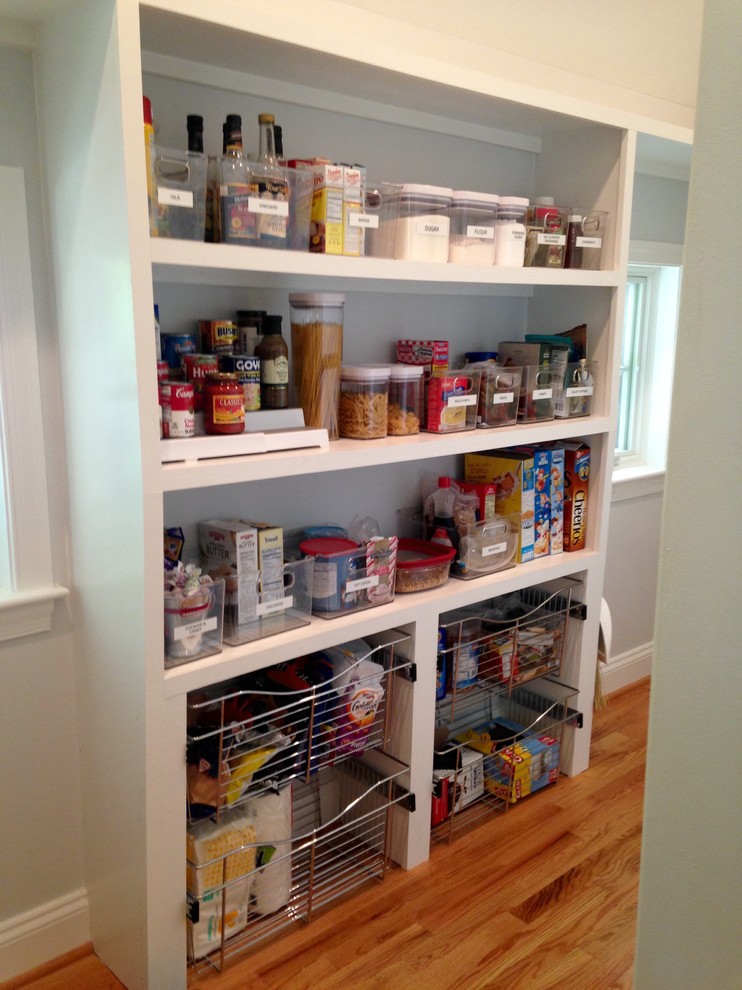 Photo of a contemporary kitchen pantry in Baltimore with light hardwood flooring.