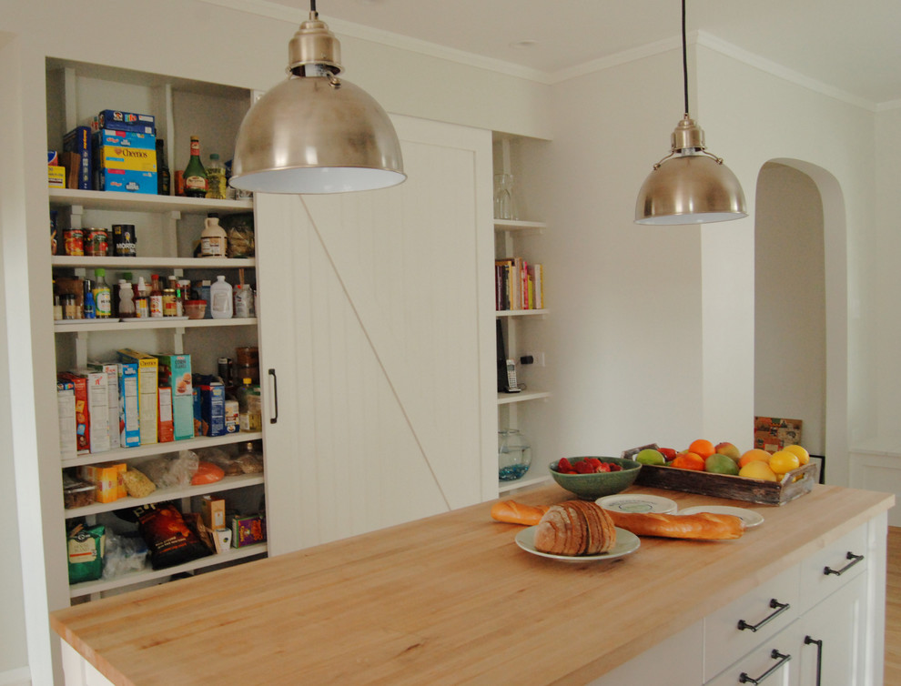 Inspiration for a farmhouse kitchen remodel in Chicago with open cabinets, white cabinets and wood countertops
