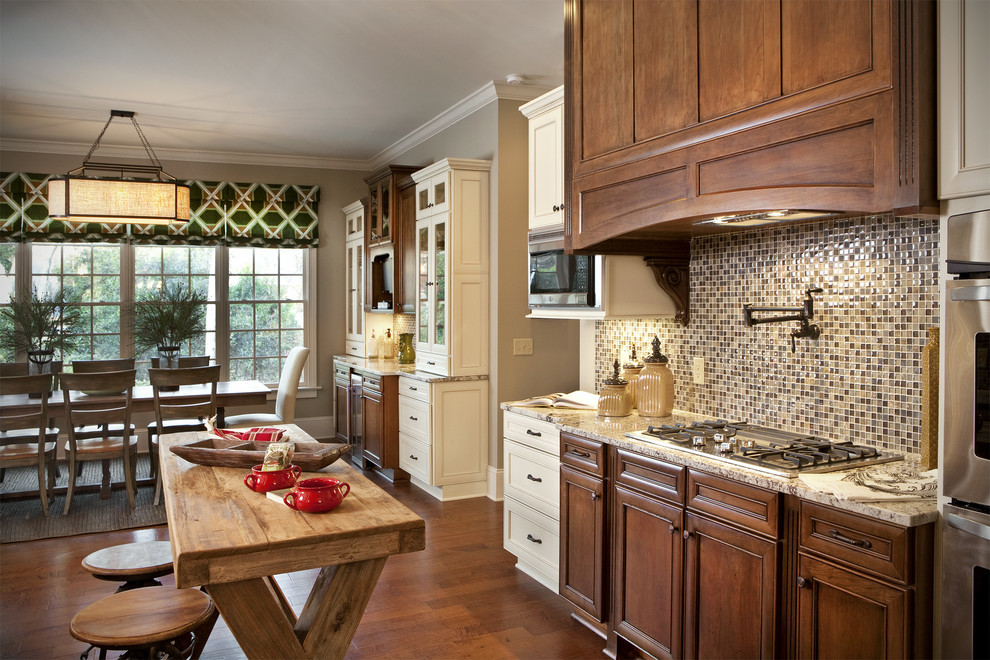 Design ideas for a classic kitchen in Charlotte with recessed-panel cabinets, dark wood cabinets, brown splashback, mosaic tiled splashback, granite worktops and dark hardwood flooring.