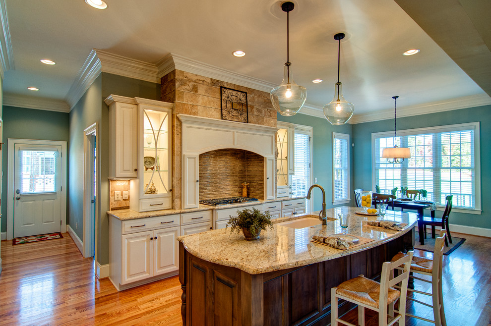 Example of a classic kitchen design in Charlotte with granite countertops