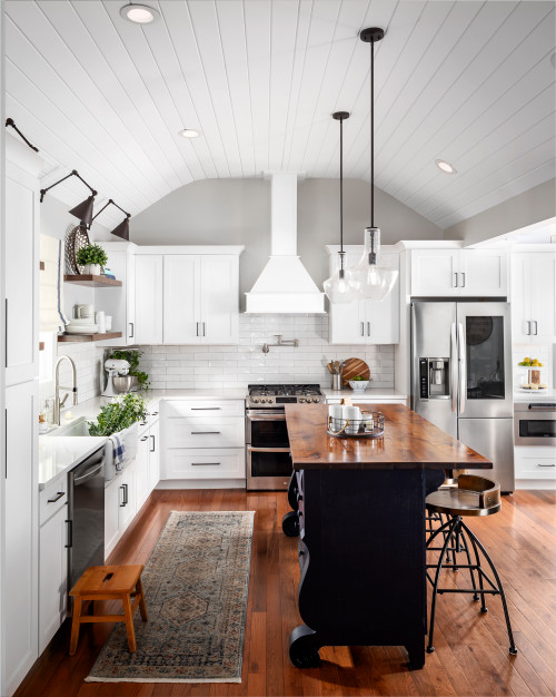 Black Kitchen Island with Wooden Countertop and White Farmhouse Kitchen Cabinets