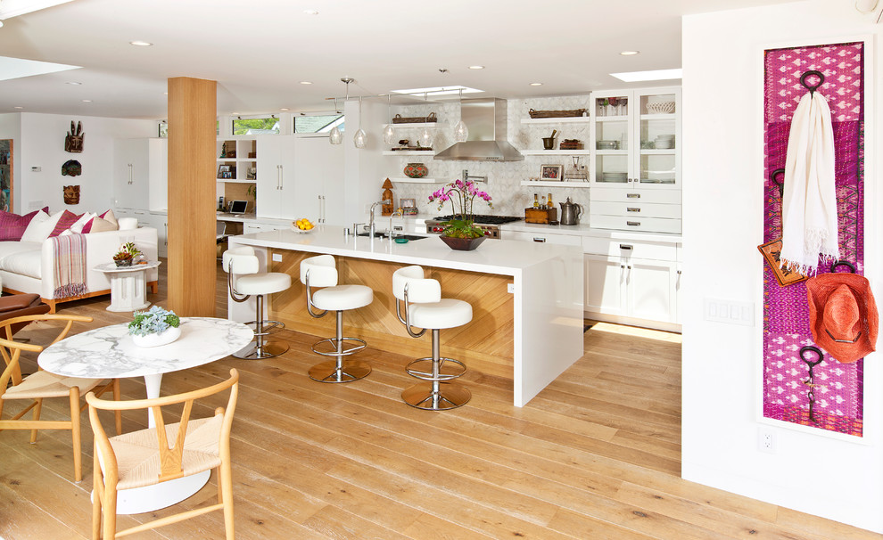 Design ideas for a contemporary l-shaped open plan kitchen in Los Angeles with white cabinets.