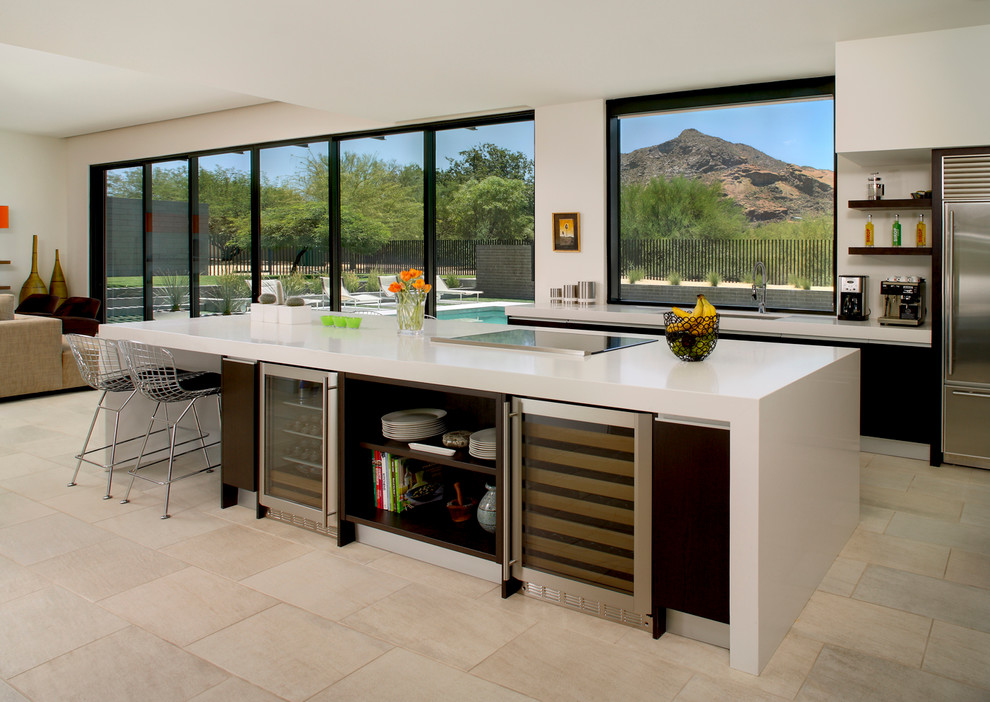 Inspiration for a modern open plan kitchen in Phoenix with flat-panel cabinets and stainless steel appliances.