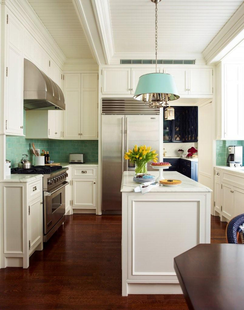 Inspiration for a small timeless u-shaped medium tone wood floor eat-in kitchen remodel in New York with flat-panel cabinets, white cabinets, marble countertops, green backsplash, ceramic backsplash, stainless steel appliances and an island
