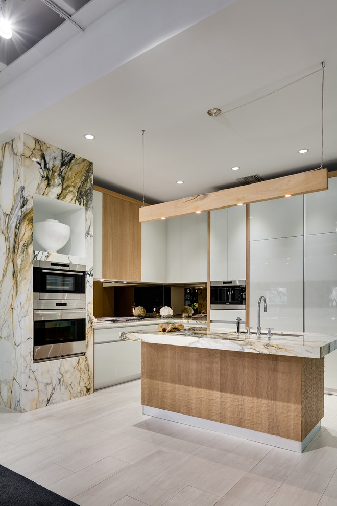 Photo of a large modern l-shaped enclosed kitchen in Miami with a submerged sink, flat-panel cabinets, white cabinets, mirror splashback, stainless steel appliances, porcelain flooring, an island, white floors and multicoloured worktops.