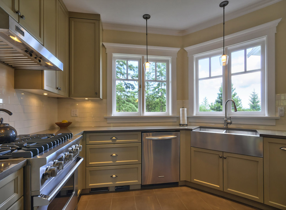 Design ideas for a contemporary kitchen in Vancouver with stainless steel appliances and a belfast sink.