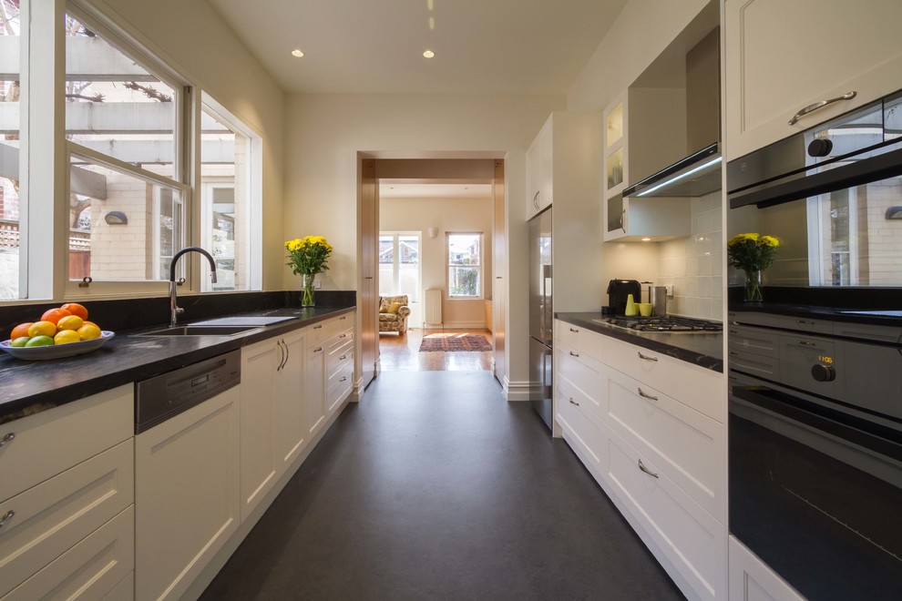 Inspiration for a medium sized traditional galley enclosed kitchen in Melbourne with a built-in sink, shaker cabinets, white cabinets, granite worktops and no island.