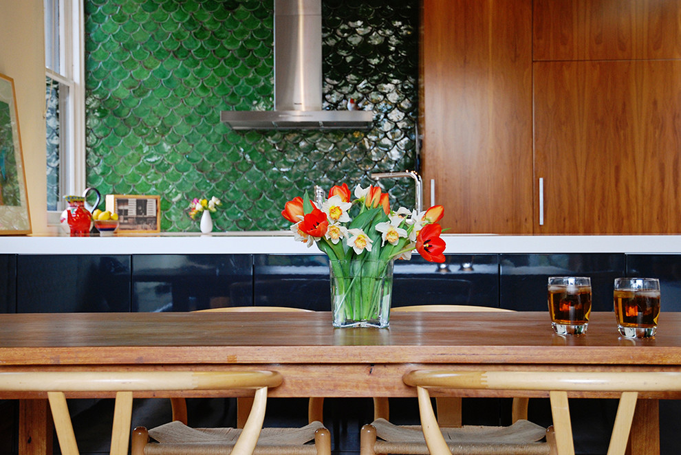Example of a mid-century modern kitchen design in Melbourne