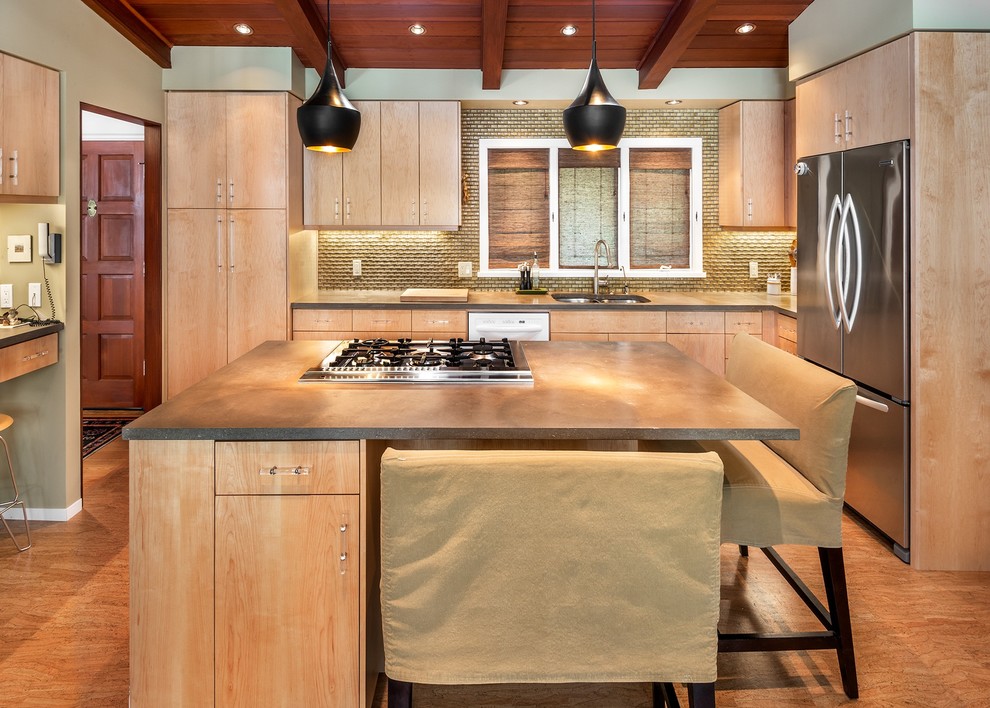 Example of a mid-sized transitional l-shaped light wood floor and beige floor open concept kitchen design in San Francisco with an undermount sink, flat-panel cabinets, light wood cabinets, solid surface countertops, metallic backsplash, stainless steel appliances and an island