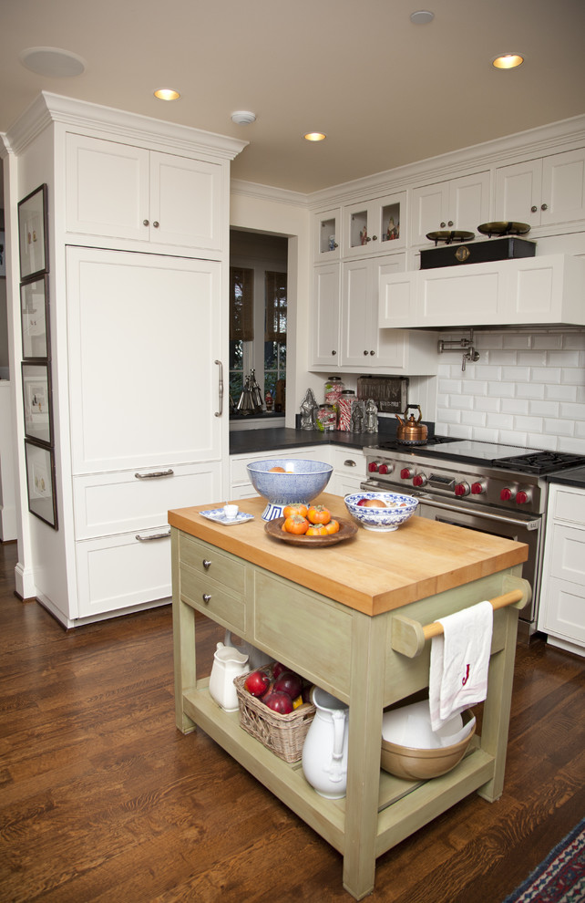 Inspiration for a timeless kitchen remodel in Portland with recessed-panel cabinets, white cabinets, white backsplash, subway tile backsplash and stainless steel appliances