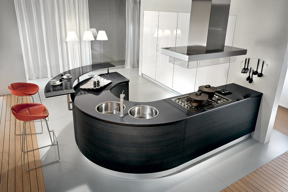 Inspiration for a medium sized contemporary u-shaped kitchen/diner in New York with a double-bowl sink, dark wood cabinets, glass worktops, stainless steel appliances and an island.