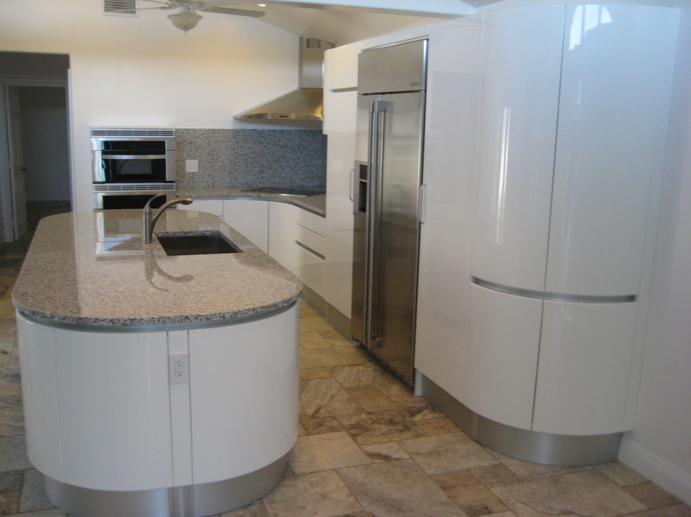 Mid-sized minimalist l-shaped ceramic tile kitchen pantry photo in San Diego with a single-bowl sink, flat-panel cabinets, white cabinets, quartzite countertops, multicolored backsplash, mosaic tile backsplash, stainless steel appliances and an island