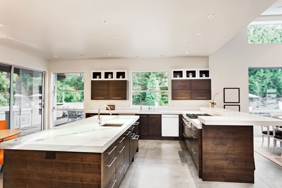 Photo of a large contemporary l-shaped kitchen pantry in Seattle with a submerged sink, flat-panel cabinets, dark wood cabinets, marble worktops, concrete flooring, an island and grey floors.