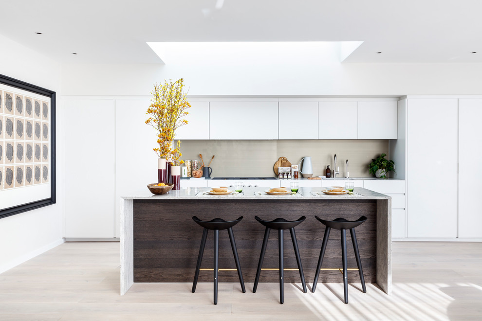 Inspiration for a medium sized contemporary open plan kitchen in London with an island.