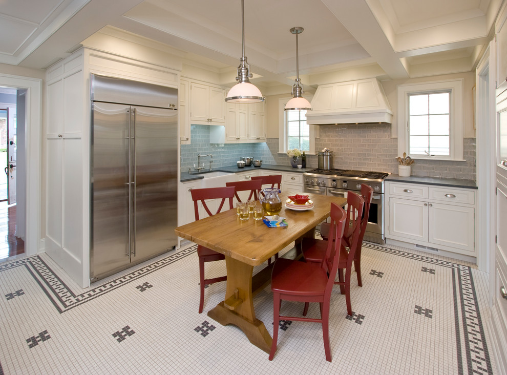 Inspiration for a large classic u-shaped kitchen/diner in New York with a belfast sink, beaded cabinets, white cabinets, metallic splashback, metro tiled splashback, stainless steel appliances, soapstone worktops and ceramic flooring.