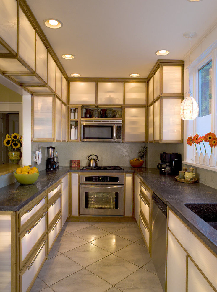 Example of a trendy kitchen design in Other with an integrated sink, glass-front cabinets and stainless steel appliances