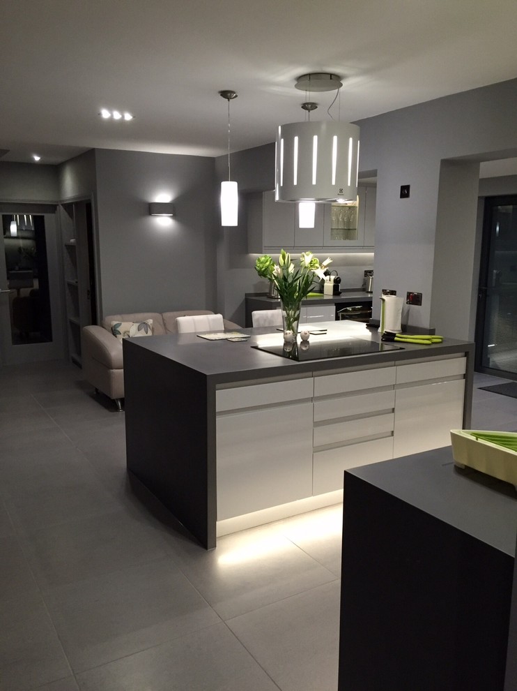 Photo of a medium sized contemporary kitchen in Other with composite countertops.