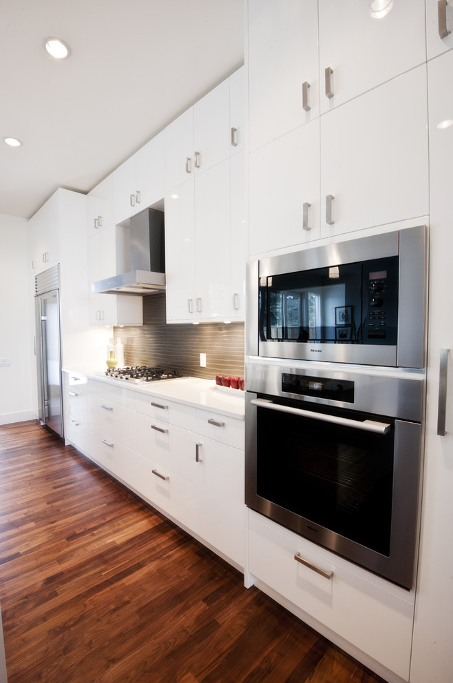 Example of a trendy kitchen design in Calgary with stainless steel appliances