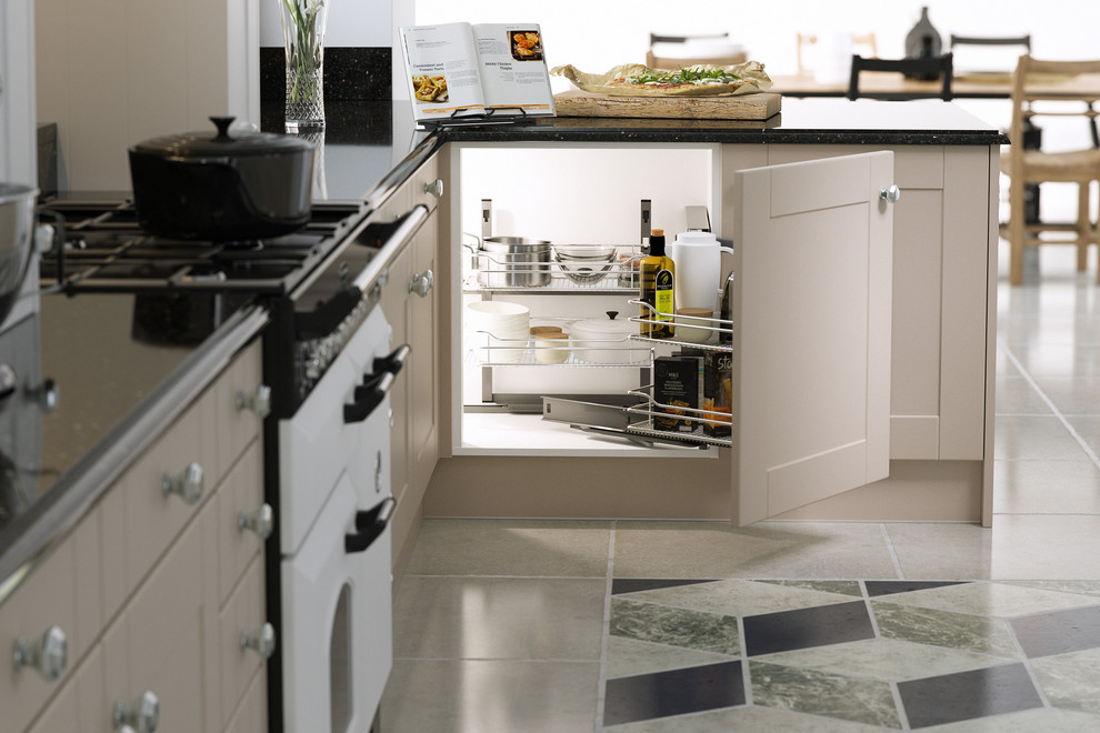 Design ideas for a large traditional l-shaped open plan kitchen in Other with beaded cabinets, beige cabinets, granite worktops, black splashback, white appliances, ceramic flooring and multi-coloured floors.