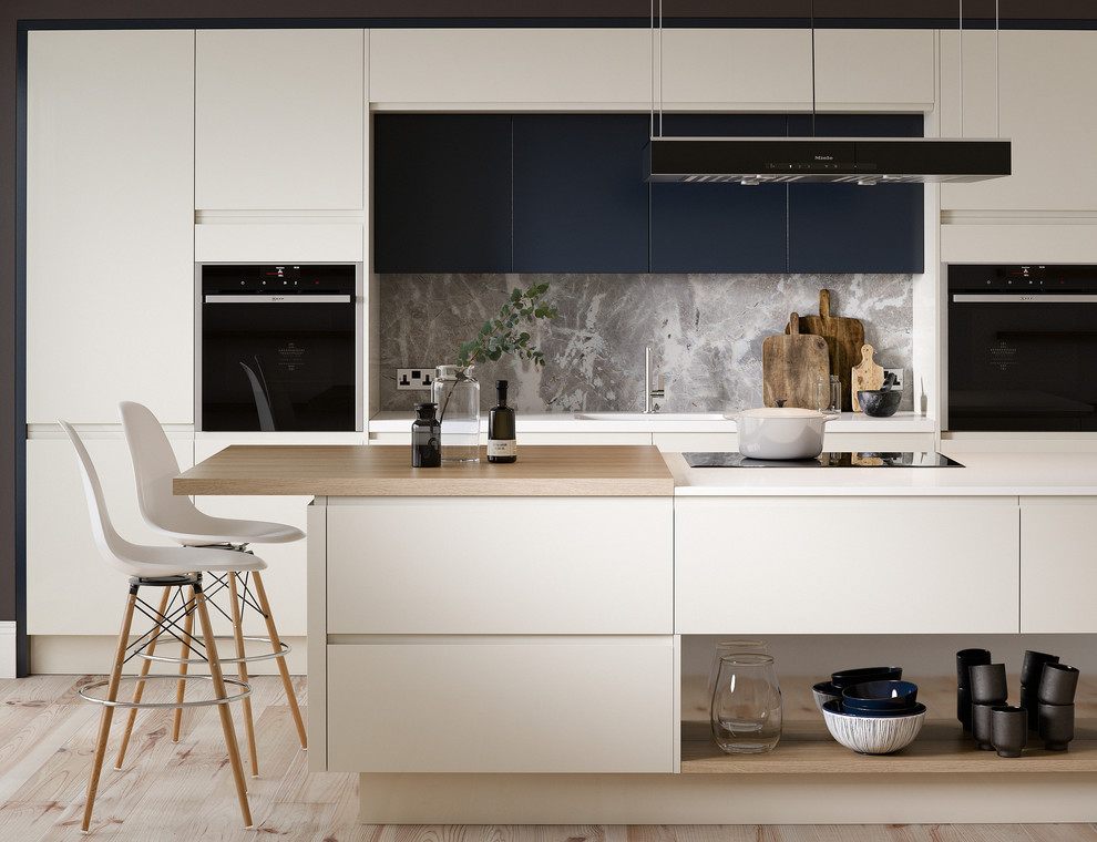 Photo of a large modern single-wall open plan kitchen in Other with an integrated sink, shaker cabinets, white cabinets, marble worktops, multi-coloured splashback, stone slab splashback, black appliances, dark hardwood flooring, an island and brown floors.