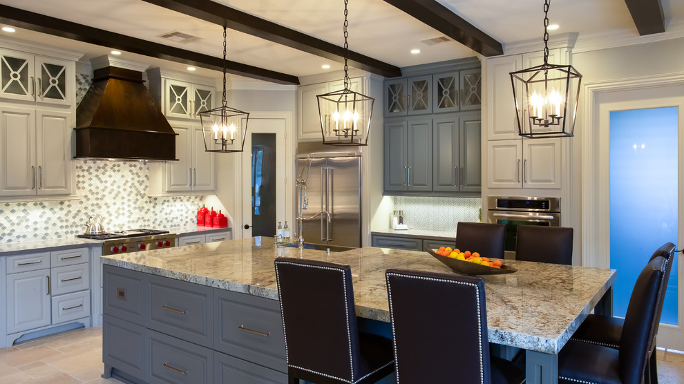 Inspiration for a large country l-shaped limestone floor open concept kitchen remodel in Houston with a farmhouse sink, raised-panel cabinets, white cabinets, granite countertops, gray backsplash, mosaic tile backsplash, stainless steel appliances and an island