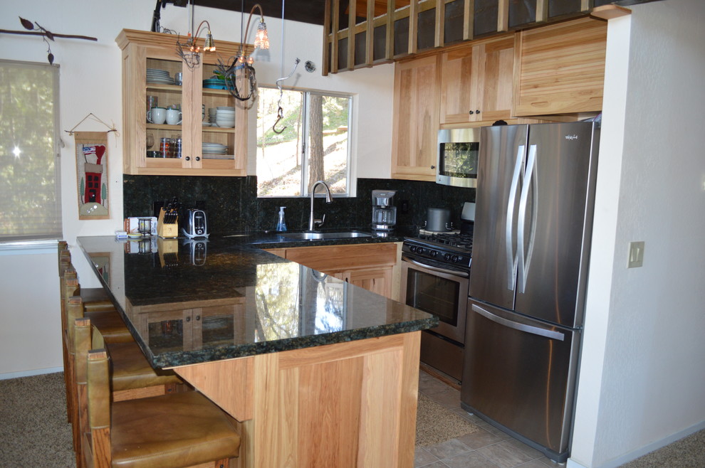 Small classic u-shaped kitchen/diner in Sacramento with a submerged sink, shaker cabinets, light wood cabinets, engineered stone countertops, stone slab splashback, stainless steel appliances and ceramic flooring.