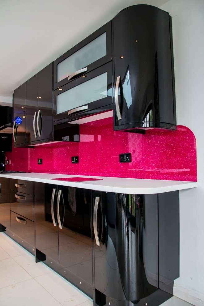 Kitchen - modern kitchen idea in Hertfordshire with pink backsplash and glass sheet backsplash