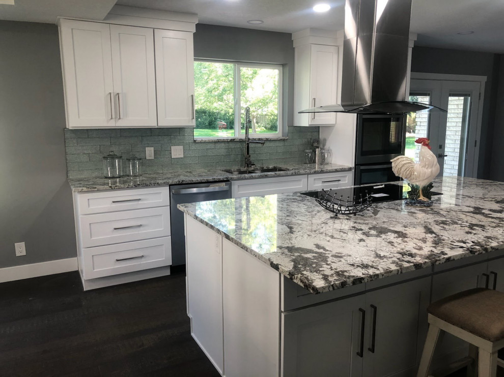 Large classic kitchen in Salt Lake City with a double-bowl sink, white cabinets, granite worktops, an island and multicoloured worktops.