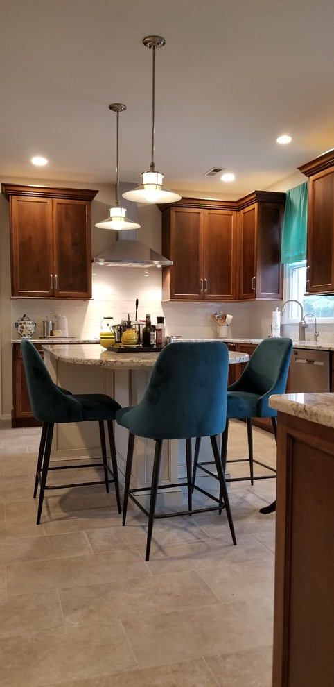 Medium sized classic l-shaped enclosed kitchen in Philadelphia with a submerged sink, recessed-panel cabinets, medium wood cabinets, granite worktops, white splashback, metro tiled splashback, stainless steel appliances, porcelain flooring, an island, beige floors and multicoloured worktops.