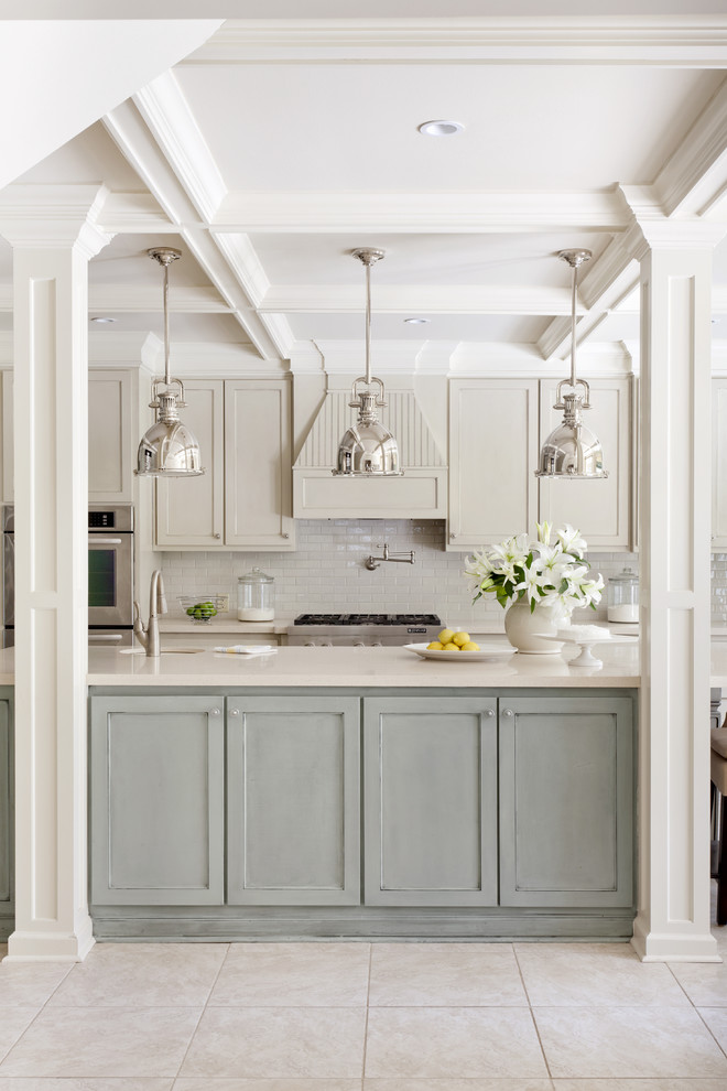 Mid-sized transitional kitchen photo in Little Rock with stainless steel appliances, subway tile backsplash, recessed-panel cabinets, blue cabinets, white backsplash, an undermount sink, quartz countertops and an island