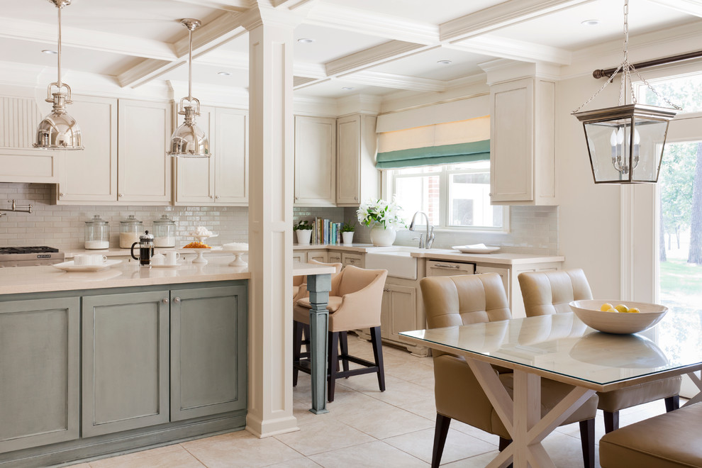 Example of a mid-sized transitional u-shaped eat-in kitchen design in Little Rock with subway tile backsplash, a farmhouse sink, recessed-panel cabinets, quartz countertops, white backsplash, paneled appliances, an island and beige cabinets