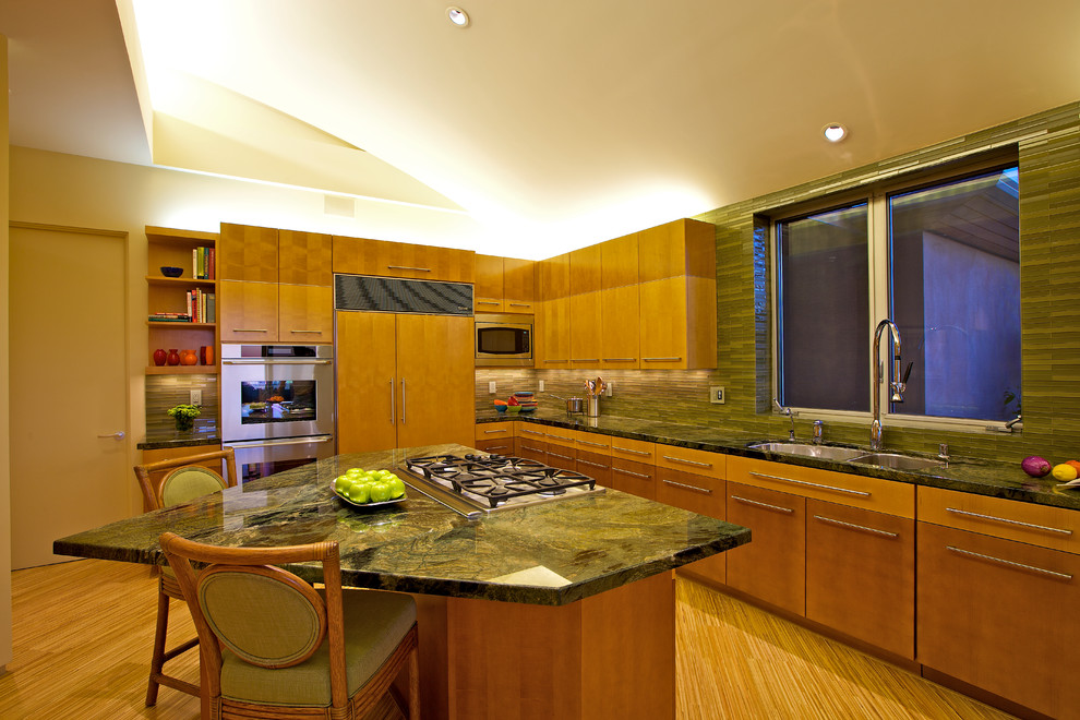 Large trendy eat-in kitchen photo in San Diego with a double-bowl sink, flat-panel cabinets, medium tone wood cabinets, brown backsplash, stainless steel appliances and an island