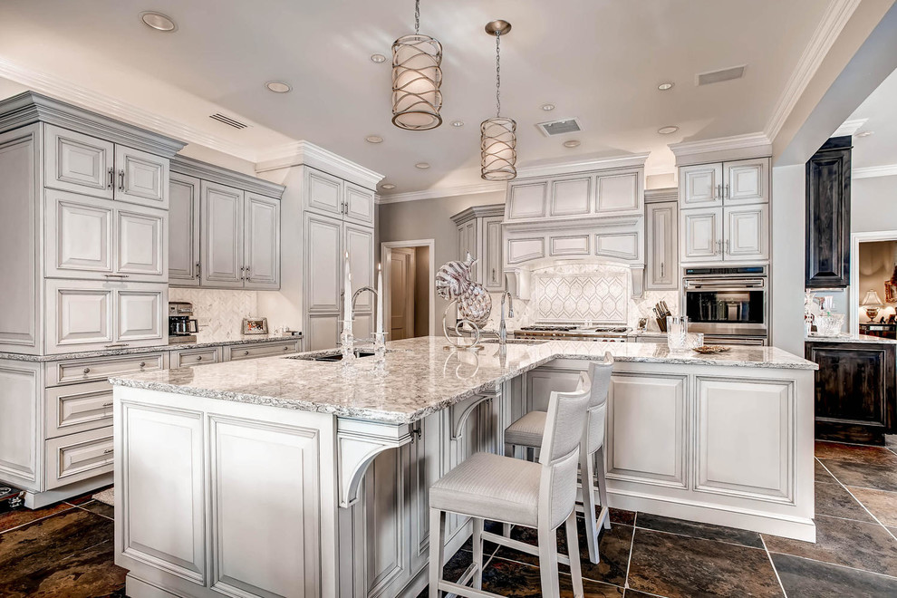 Large elegant u-shaped open concept kitchen photo in Denver with a single-bowl sink, beaded inset cabinets, white cabinets, granite countertops, white backsplash, stainless steel appliances and an island