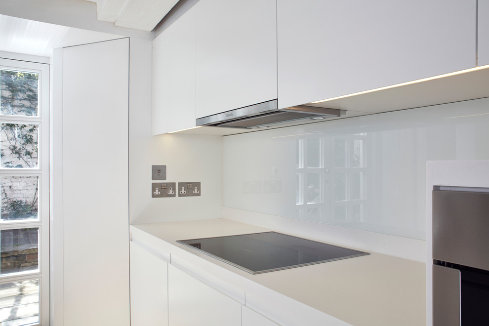 Example of a mid-sized trendy kitchen design in London