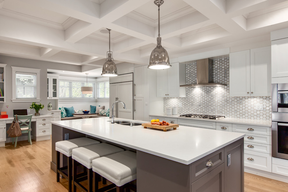 Example of a large transitional galley medium tone wood floor open concept kitchen design in Vancouver with a double-bowl sink, recessed-panel cabinets, white cabinets, gray backsplash, paneled appliances, an island, quartz countertops, mosaic tile backsplash and white countertops