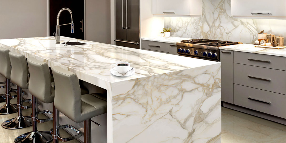 Inspiration for a kitchen remodel in Other with white cabinets, white backsplash, an island and white countertops