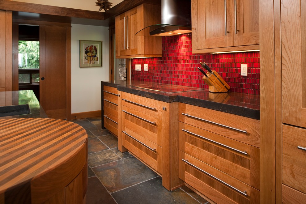 Example of a large trendy u-shaped ceramic tile eat-in kitchen design in Seattle with an undermount sink, medium tone wood cabinets, onyx countertops, red backsplash, ceramic backsplash, stainless steel appliances and an island