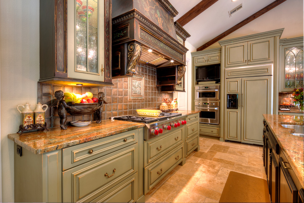 Design ideas for a medium sized rustic enclosed kitchen in Orlando with a submerged sink, glass-front cabinets, green cabinets, granite worktops, brown splashback, porcelain splashback, integrated appliances, porcelain flooring and an island.
