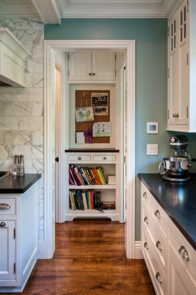 Kitchen - traditional kitchen idea in San Francisco with recessed-panel cabinets, white cabinets, white backsplash and marble backsplash