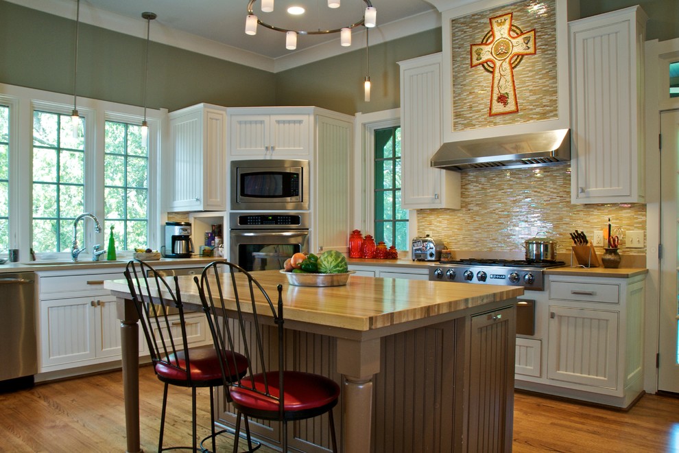 Inspiration for a timeless kitchen remodel in Nashville with stainless steel appliances and wood countertops