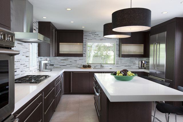 Example of a large trendy u-shaped porcelain tile and brown floor kitchen design in Phoenix with an undermount sink, flat-panel cabinets, dark wood cabinets, quartz countertops, gray backsplash, matchstick tile backsplash, stainless steel appliances and an island