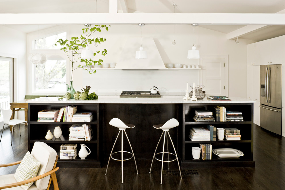 Inspiration for a mid-century modern galley open concept kitchen remodel in Portland with stainless steel appliances