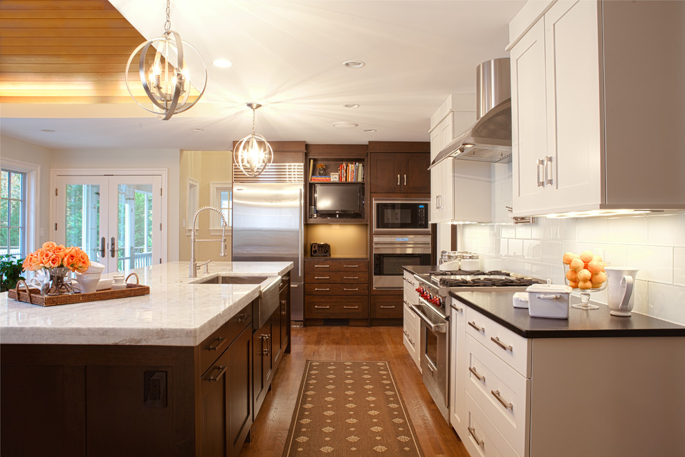 Transitional kitchen photo in DC Metro with stainless steel appliances and a farmhouse sink