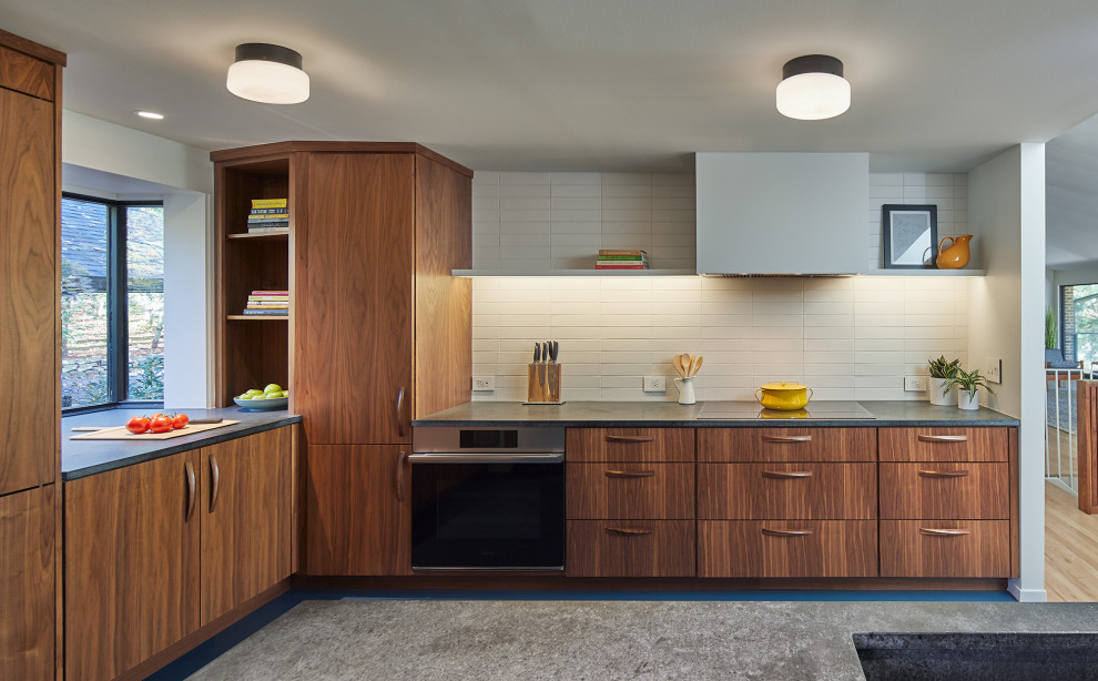 Design ideas for a retro kitchen in DC Metro with an integrated sink, flat-panel cabinets, medium wood cabinets, soapstone worktops, white splashback, ceramic splashback, stainless steel appliances, lino flooring, blue floors and grey worktops.