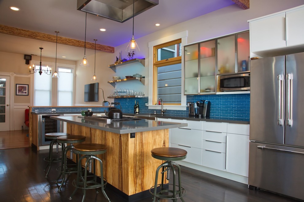 Kitchen - mid-sized contemporary l-shaped brown floor and vinyl floor kitchen idea in San Francisco with white cabinets, blue backsplash, stainless steel appliances, a farmhouse sink, flat-panel cabinets, quartz countertops, glass tile backsplash, an island and gray countertops