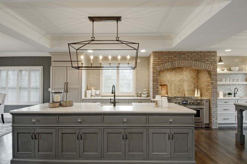Large farmhouse galley dark wood floor eat-in kitchen photo in Columbus with beaded inset cabinets, gray cabinets, quartz countertops, brick backsplash, stainless steel appliances, two islands and an undermount sink