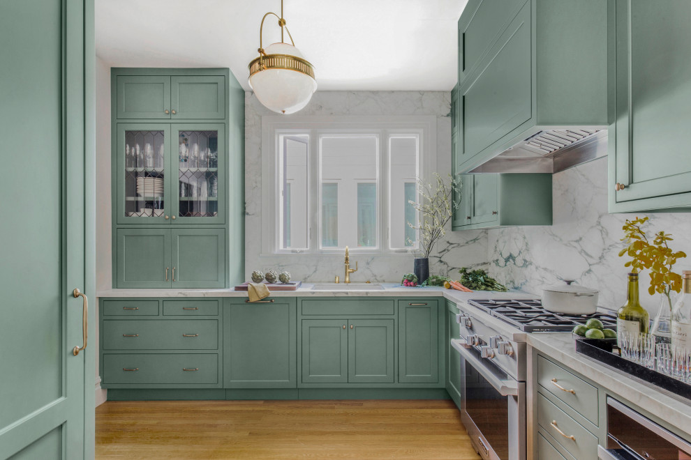 Photo of a small victorian l-shaped kitchen in San Francisco with marble worktops, marble splashback, light hardwood flooring and white worktops.