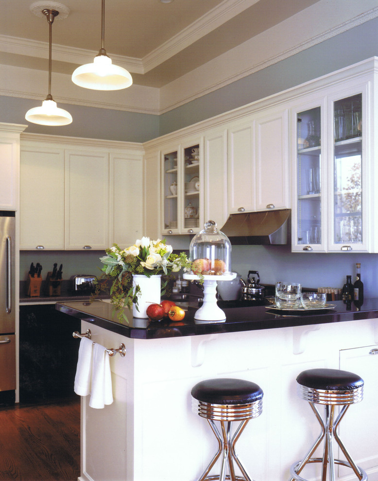 Kitchen - eclectic kitchen idea in San Francisco with recessed-panel cabinets and white cabinets