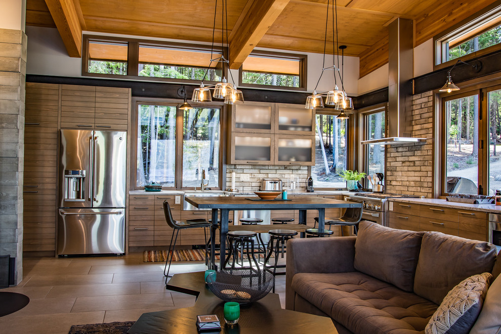 Mid-sized urban l-shaped concrete floor and beige floor kitchen photo in Seattle with a farmhouse sink, flat-panel cabinets, medium tone wood cabinets, quartzite countertops, multicolored backsplash, brick backsplash, stainless steel appliances, an island and gray countertops